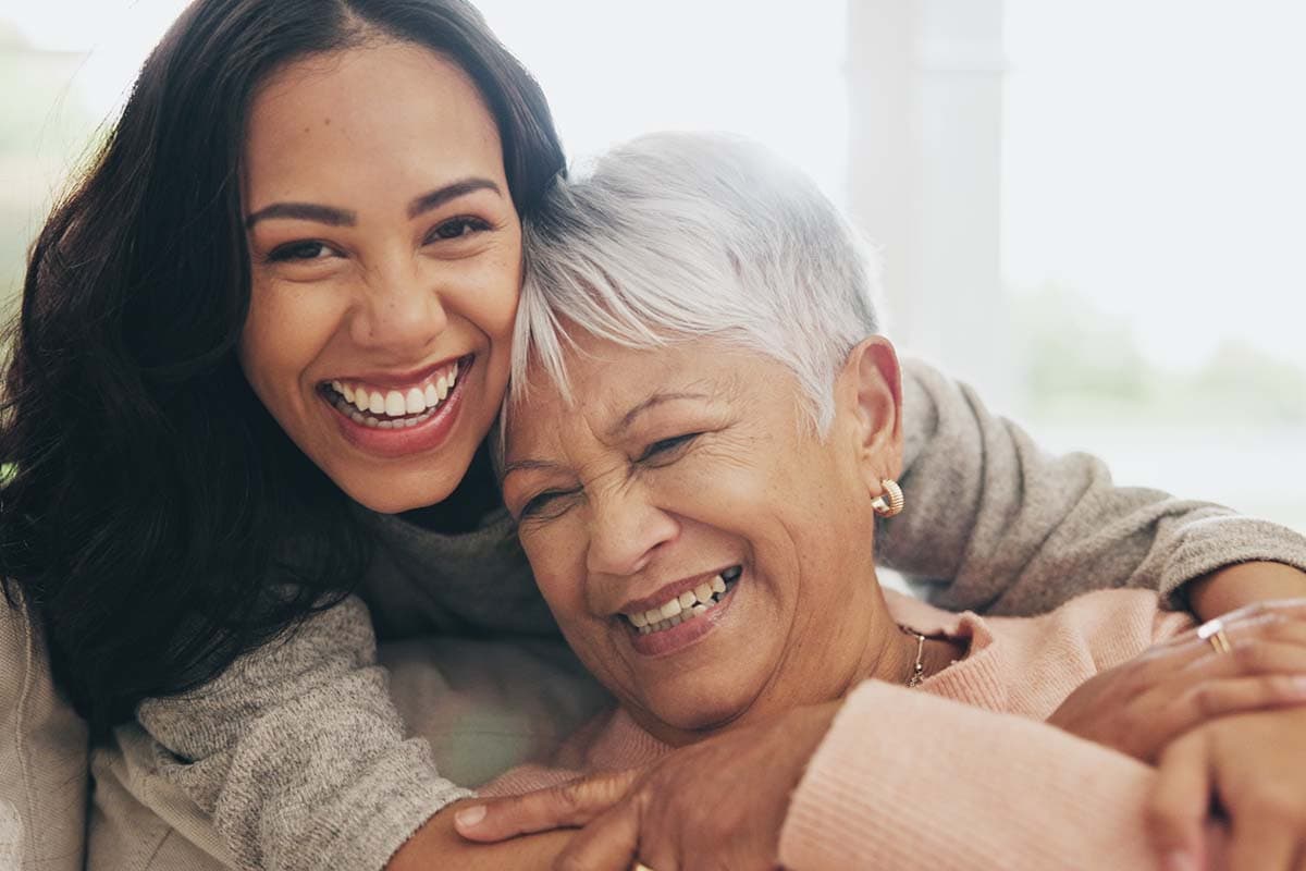 Mom And Daughter Smiling - Memory Care At Better Living At Liberty Court